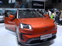 People look at various vehicles at the 23rd Autumn International Auto Show in Qingdao, China, on September 5, 2024. (