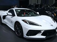 People look at various vehicles at the 23rd Autumn International Auto Show in Qingdao, China, on September 5, 2024. (