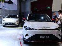 People look at various vehicles at the 23rd Autumn International Auto Show in Qingdao, China, on September 5, 2024. (