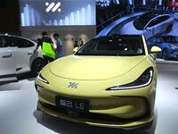 People look at various vehicles at the 23rd Autumn International Auto Show in Qingdao, China, on September 5, 2024. (