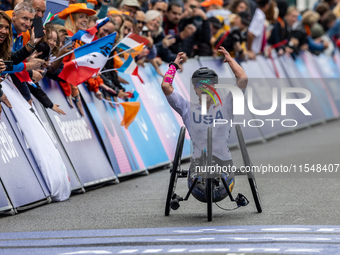 Oksana Masters reacts after she wins the Para-Cycling - Women's H5 Road Race at Clichy-sous-Bois during the Paris 2024 Paralympic Games in P...