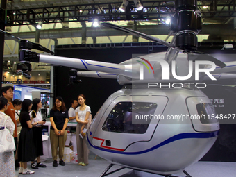 Visitors attend the 2024 Suzhou International New Energy Expo in Suzhou, China, on September 5, 2024. (