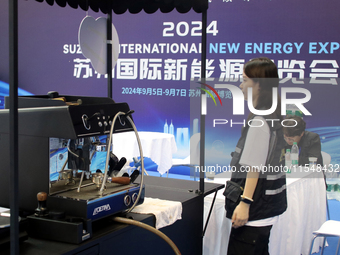 Visitors attend the 2024 Suzhou International New Energy Expo in Suzhou, China, on September 5, 2024. (