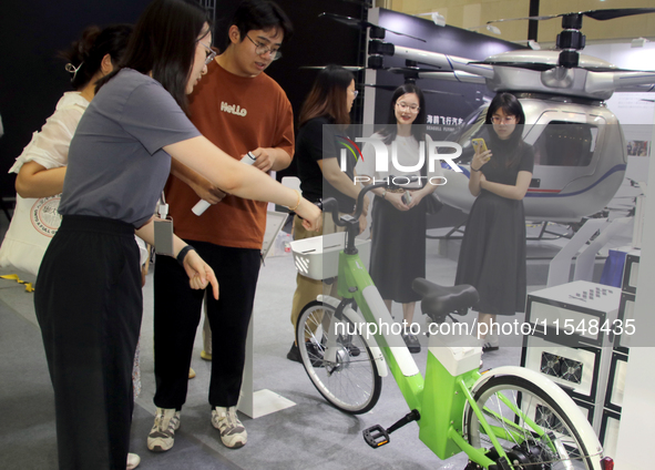 Visitors attend the 2024 Suzhou International New Energy Expo in Suzhou, China, on September 5, 2024. 