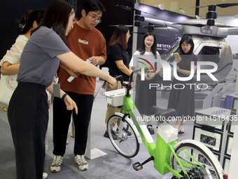 Visitors attend the 2024 Suzhou International New Energy Expo in Suzhou, China, on September 5, 2024. (