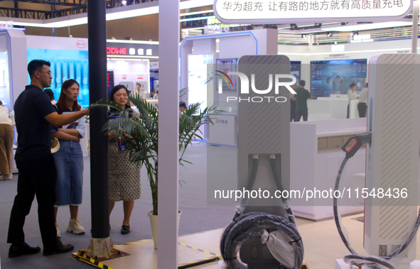 Visitors visit the Huawei Supercharger at the 2024 Suzhou International New Energy Expo in Suzhou, China, on September 5, 2024. 