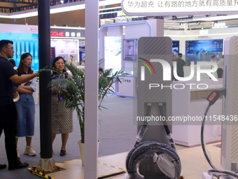 Visitors visit the Huawei Supercharger at the 2024 Suzhou International New Energy Expo in Suzhou, China, on September 5, 2024. (