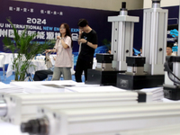 Visitors attend the 2024 Suzhou International New Energy Expo in Suzhou, China, on September 5, 2024. (