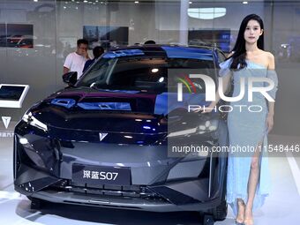 A model displays a new car at the 23rd Autumn International Auto Show in Qingdao, China, on September 5, 2024. (