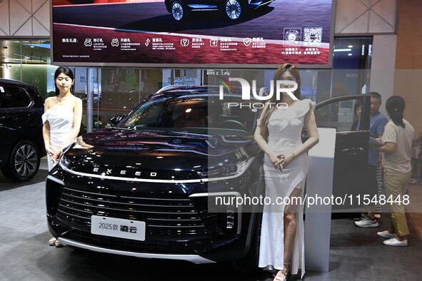 A model displays a new car at the 23rd Autumn International Auto Show in Qingdao, China, on September 5, 2024. 