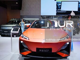 A model displays a new car at the 23rd Autumn International Auto Show in Qingdao, China, on September 5, 2024. (