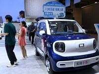 Promotional information about replacement vehicles is seen at the 23rd Autumn International Auto Show 2024 in Qingdao, China, on September 5...