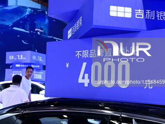 Promotional information about replacement vehicles is seen at the 23rd Autumn International Auto Show 2024 in Qingdao, China, on September 5...