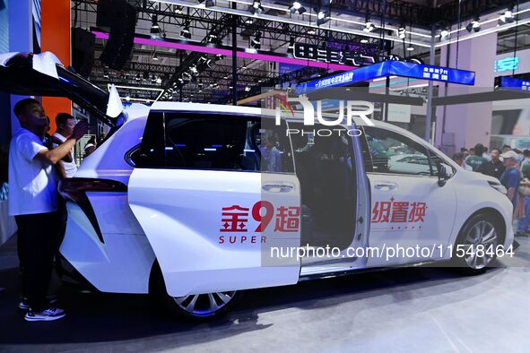 Promotional information about replacement vehicles is seen at the 23rd Autumn International Auto Show 2024 in Qingdao, China, on September 5...