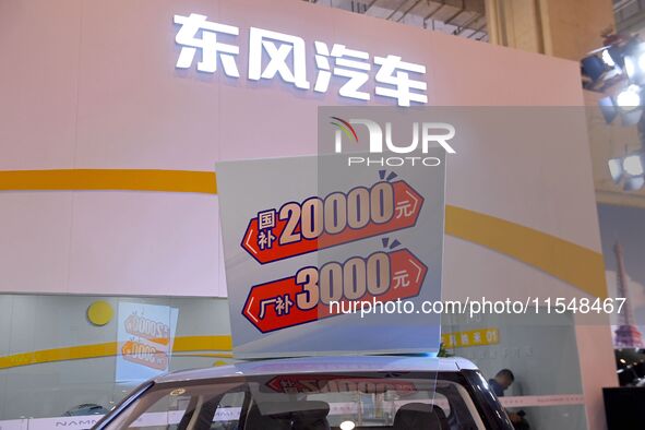 Promotional information about replacement vehicles is seen at the 23rd Autumn International Auto Show 2024 in Qingdao, China, on September 5...