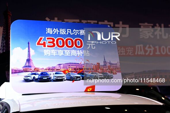 Promotional information about replacement vehicles is seen at the 23rd Autumn International Auto Show 2024 in Qingdao, China, on September 5...