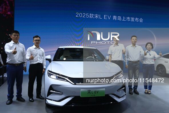 A new car is unveiled at the 23rd Autumn International Auto Show in Qingdao, China, on September 5, 2024. 