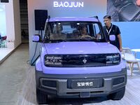 People look at various vehicles at the 23rd Autumn International Auto Show in Qingdao, China, on September 5, 2024. (