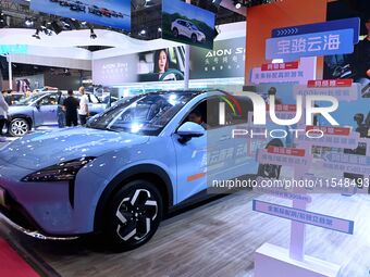 People look at various vehicles at the 23rd Autumn International Auto Show in Qingdao, China, on September 5, 2024. (