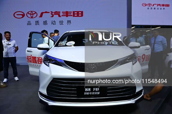 People look at various vehicles at the 23rd Autumn International Auto Show in Qingdao, China, on September 5, 2024. 