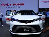 People look at various vehicles at the 23rd Autumn International Auto Show in Qingdao, China, on September 5, 2024. (