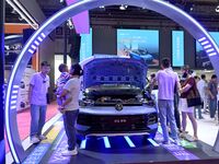 People look at various vehicles at the 23rd Autumn International Auto Show in Qingdao, China, on September 5, 2024. (