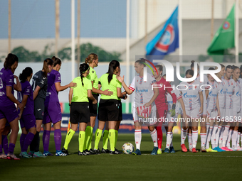 In Ta' Qali, Malta, on September 4, 2024, Anderlecht and Crvena Zvezda players shake hands prior to the UEFA Women's Champions League First...