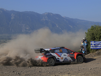 Driver Thierry Neuville and co-driver Martijn Wydaeghe of the Hyundai Shell Mobis World Rally Team, in a Hyundai i20 N Rally1 Hybrid, face s...