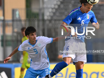 Marco Gasperoni (SMR) and Daniele Ghilardi (ITA) during the UEFA U21 Euro 2025 Qualifier match between Italy and San Marino at the Domenico...