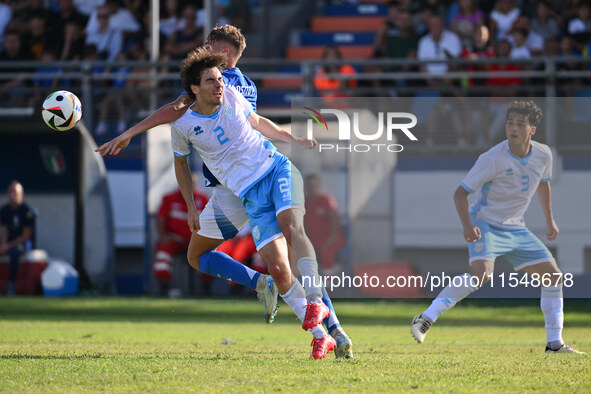 Matteo Guidi (SMR) and Pio Esposito (ITA) during the UEFA U21 Euro 2025 Qualifier match between Italy and San Marino at the Domenico Francio...