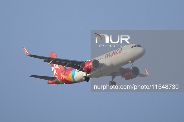 A KM Malta Airlines 9H-NEC KM Airbus flies over the match venue during the UEFA Women's Champions League First qualifying round, Semi-finals...