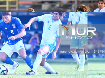 Edoardo Bove (ITA) and Mattia Sancisi (SMR) during the UEFA U21 Euro 2025 Qualifier match between Italy and San Marino at the Domenico Franc...