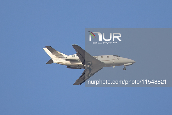 A 9H-HMJ Harmony Jets Malta Dassault Falcon 10 flies over the match venue during the UEFA Women's Champions League First qualifying round, S...