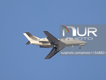 A 9H-HMJ Harmony Jets Malta Dassault Falcon 10 flies over the match venue during the UEFA Women's Champions League First qualifying round, S...