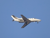 A 9H-HMJ Harmony Jets Malta Dassault Falcon 10 flies over the match venue during the UEFA Women's Champions League First qualifying round, S...