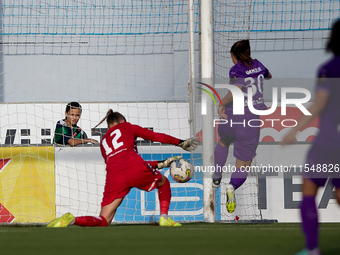 Roksana Shahanska (left), goalkeeper of Crvena Zvezda, saves the ball from a close-range shot by Luna Vanzeir (right) of Anderlecht during t...