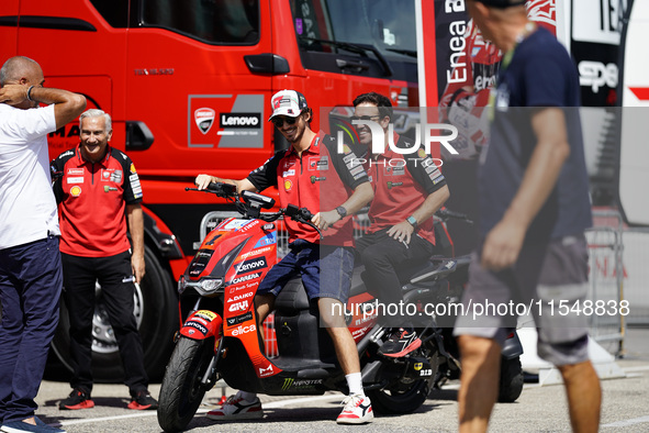 Francesco Bagnaia of Italy and Ducati Lenovo Team drives on the paddock during the preview of the MotoGP of San Marino at Misano World Circu...