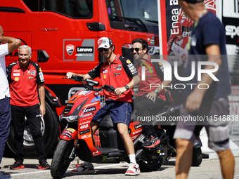 Francesco Bagnaia of Italy and Ducati Lenovo Team drives on the paddock during the preview of the MotoGP of San Marino at Misano World Circu...