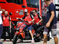 Francesco Bagnaia of Italy and Ducati Lenovo Team drives on the paddock during the preview of the MotoGP of San Marino at Misano World Circu...