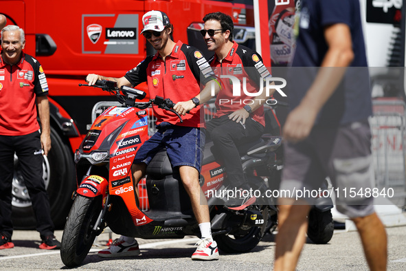 Francesco Bagnaia of Italy and Ducati Lenovo Team drives on the paddock during the preview of the MotoGP of San Marino at Misano World Circu...