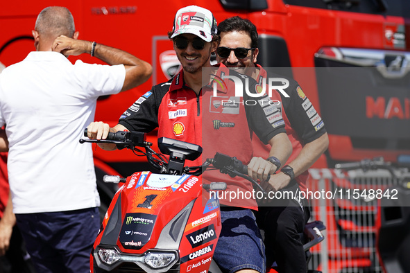 Francesco Bagnaia of Italy and Ducati Lenovo Team drives on the paddock during the preview of the MotoGP of San Marino at Misano World Circu...