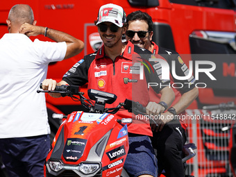 Francesco Bagnaia of Italy and Ducati Lenovo Team drives on the paddock during the preview of the MotoGP of San Marino at Misano World Circu...