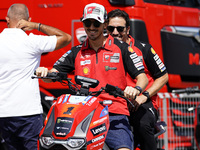 Francesco Bagnaia of Italy and Ducati Lenovo Team drives on the paddock during the preview of the MotoGP of San Marino at Misano World Circu...