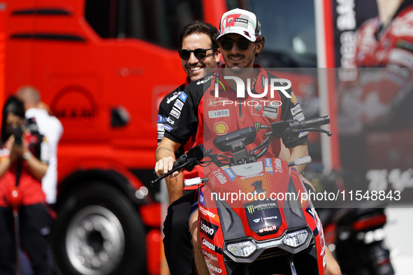 Francesco Bagnaia of Italy and Ducati Lenovo Team drives on the paddock during the preview of the MotoGP of San Marino at Misano World Circu...