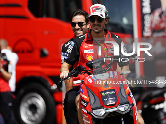 Francesco Bagnaia of Italy and Ducati Lenovo Team drives on the paddock during the preview of the MotoGP of San Marino at Misano World Circu...