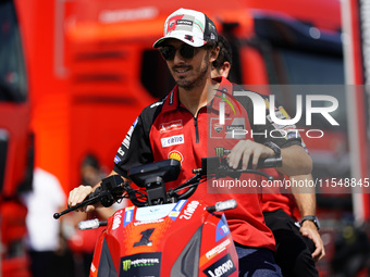 Francesco Bagnaia of Italy and Ducati Lenovo Team drives on the paddock during the preview of the MotoGP of San Marino at Misano World Circu...