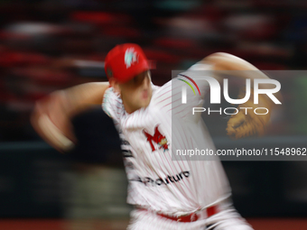 Justin Courtney #13 of Diablos Rojos pitches the ball during match 1 against Sultanes de Monterrey of the Mexican Baseball League (LMB) Seri...