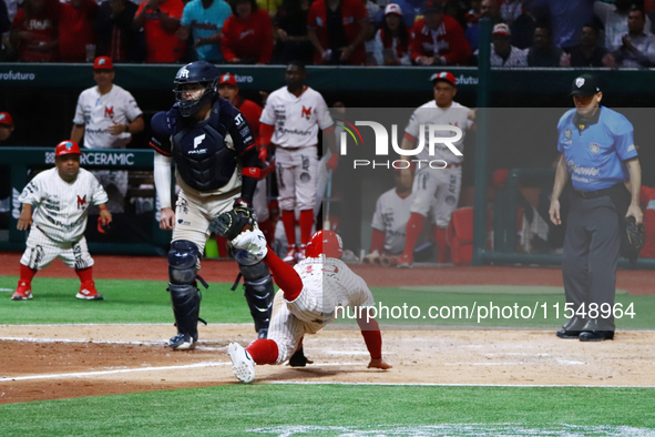 Franklin Barreto #43 of Diablos Rojos slides on the home plate during match 1 against Sultanes de Monterrey of the Mexican Baseball League (...