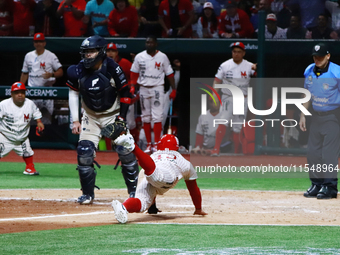 Franklin Barreto #43 of Diablos Rojos slides on the home plate during match 1 against Sultanes de Monterrey of the Mexican Baseball League (...