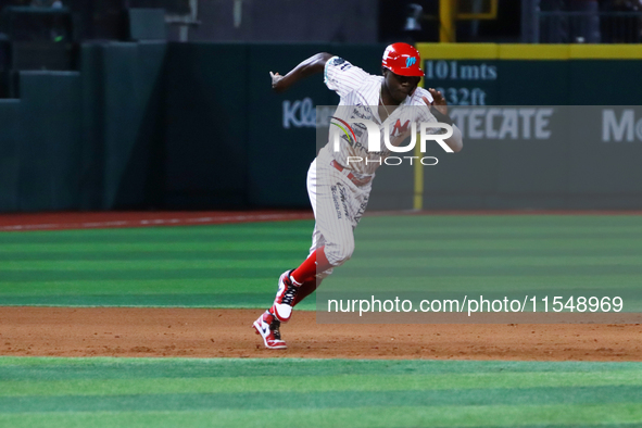 Aristides Aquino #56 of Diablos Rojos runs back to second base during match 1 against Sultanes de Monterrey of the Mexican Baseball League (...